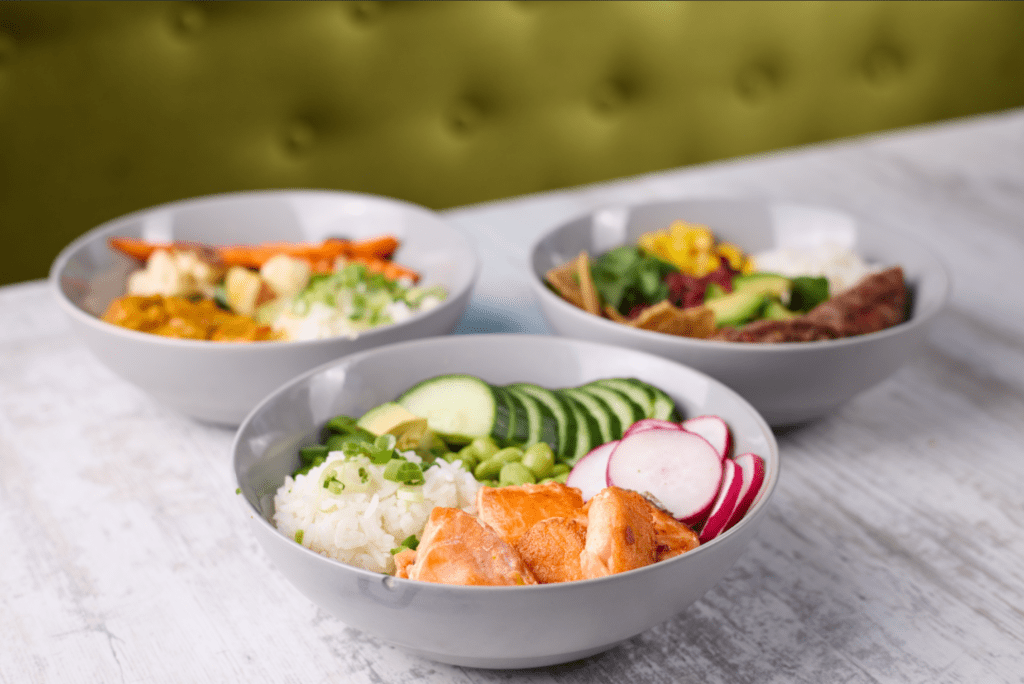 bowls-of-food-and-a-green-velvet-cloth-on-a-table