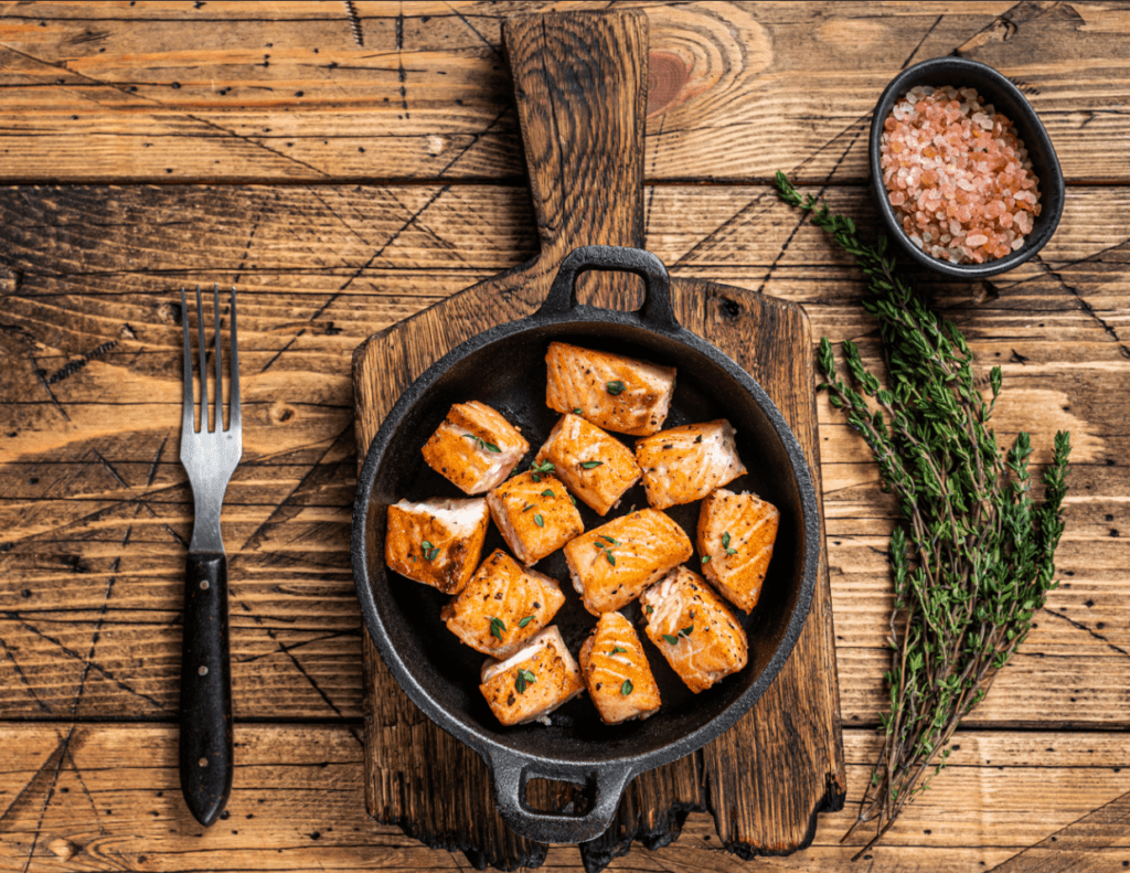 roasted-salmon-or-trout-fish-in-a-pan-wooden-back