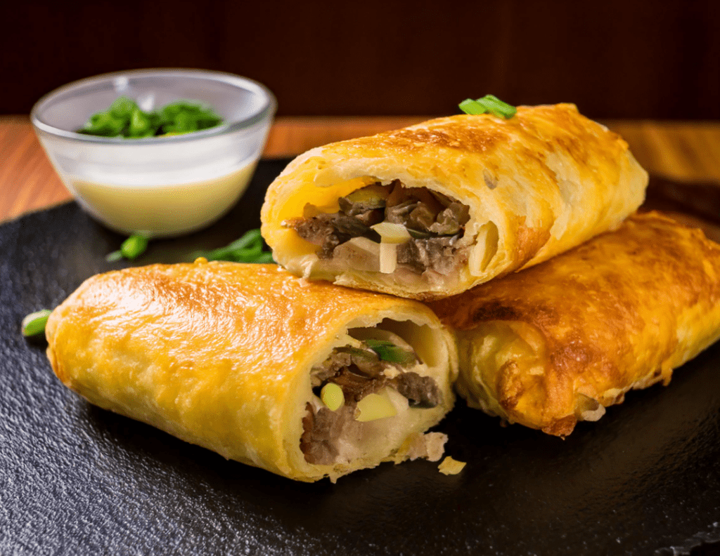 steak and cheese egg rolls​ with sauce