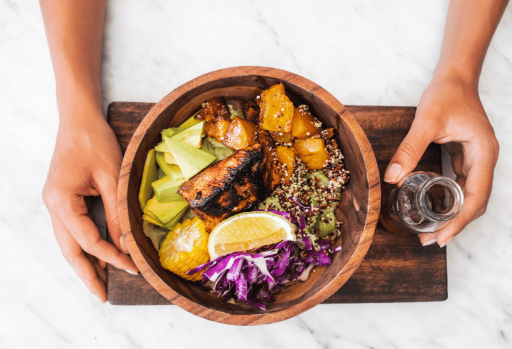 woman-eating-meal-with-fried-salmon-fish-steak